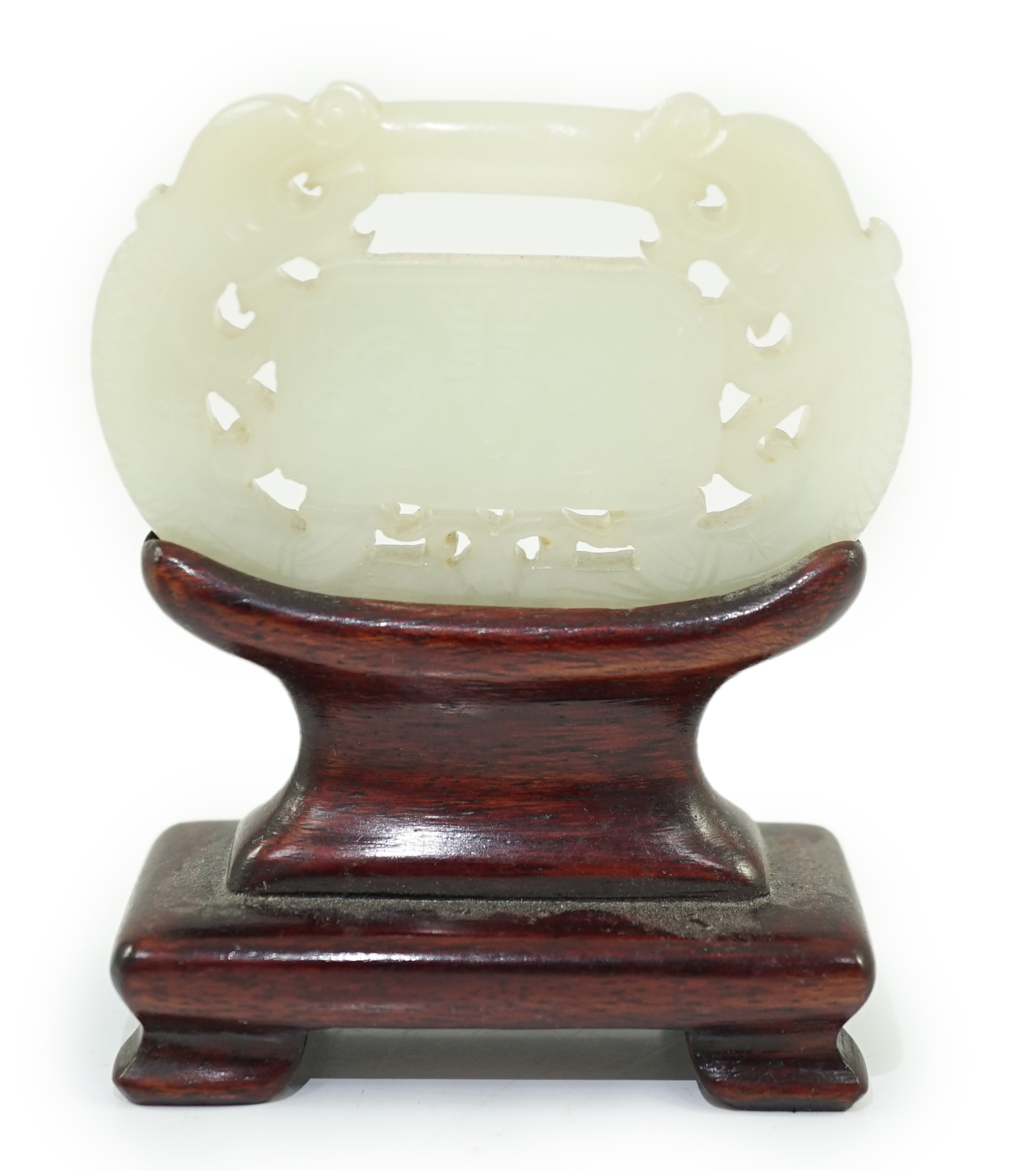 A Chinese pale celadon jade ‘lock’ pendant, 19th century